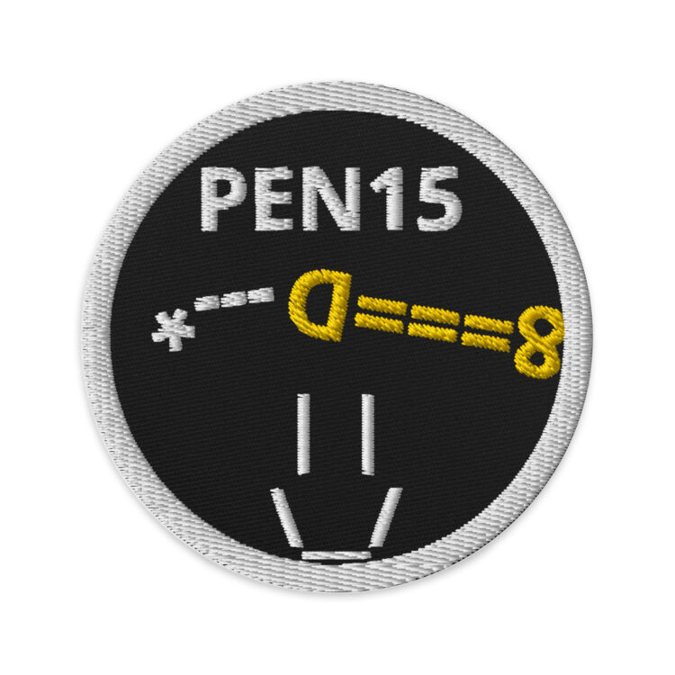 3 inch circle patch with a white outline and solid black background. Inside the circle is "PEN15" written in white centered at the top with a peeing penis underneath the words. And a smiley face underneath the penis all made out of typeface character. The smiley face and pee being the same white as the words. And the penis being gold/yellow. denimandpatches
