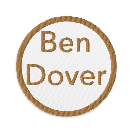 3 inch circle patch with a brown outline around a white background. With the name "Ben Dover" written in the same brown as the outline. denim and patches