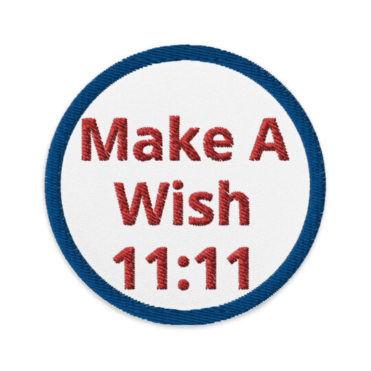 3 inch circle patch with a navy blue outline around a white background. Centered in patch are the words "Make a Wish 11:11" written in red lettering. denimandpatches