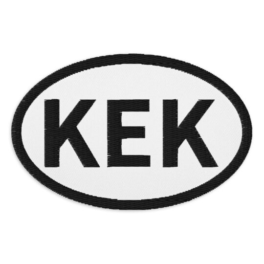 3 inch oval shaped patch with a black outline around a white background. With the letters "KEK" written in black centered in the oval. denim and patches
