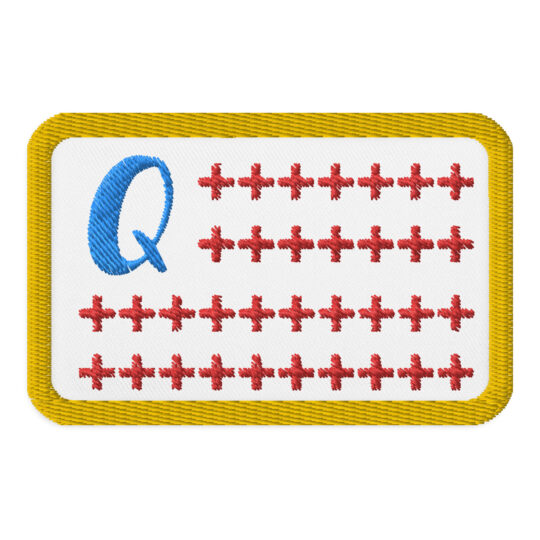 3 inch rectangle shaped patch with a gold outline around a white background imitating the shape of a flag. In the top left of the rectangle is a light blue "Q" with plus signs acting as the red stripes in an American flag. denim and patches