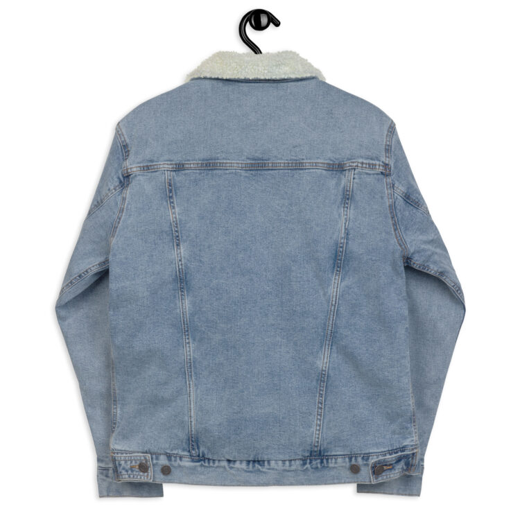 Light blue denim sherpa jacket being held up backwards by a cloth hanger. The back features 4 aged brass button along the bottom. And seams along the back of the jacket. denimandpatches